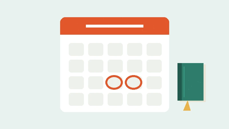 Calendar with two circled days beside a small book
